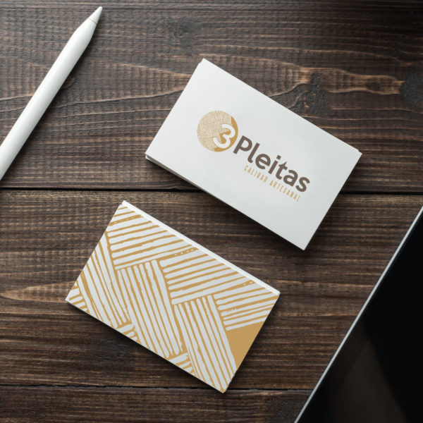 Blank white business card mockup and tablet with stylus on wood table background PSD